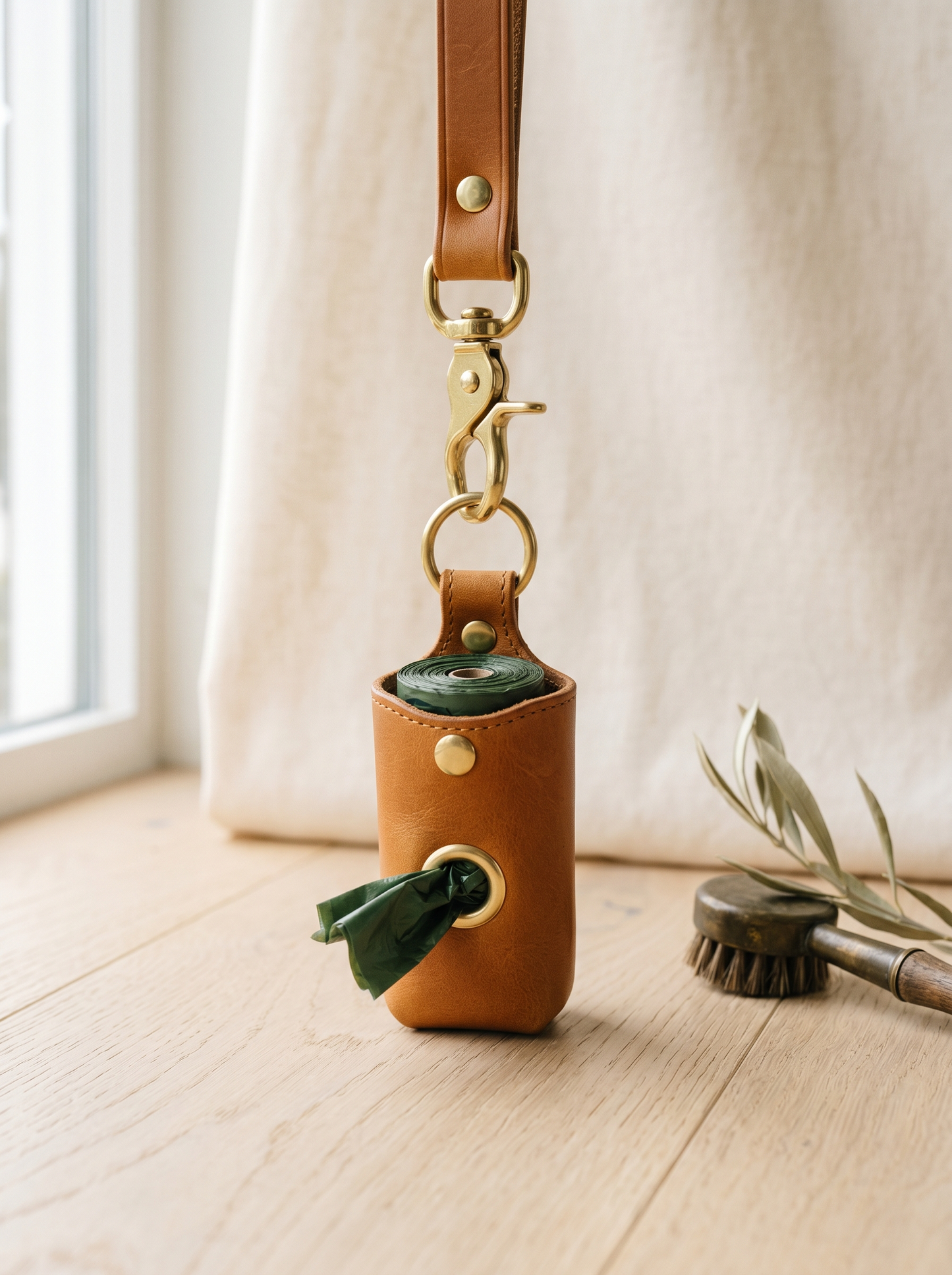 Leather and brass poop bag dispenser